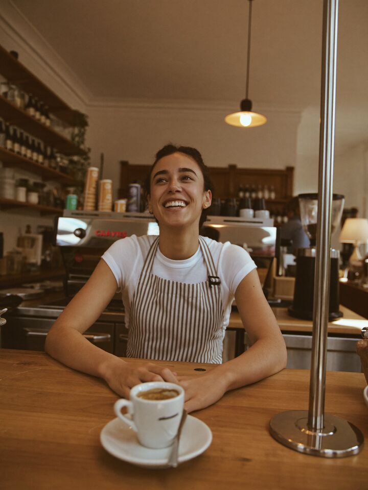 Café owner at the counter