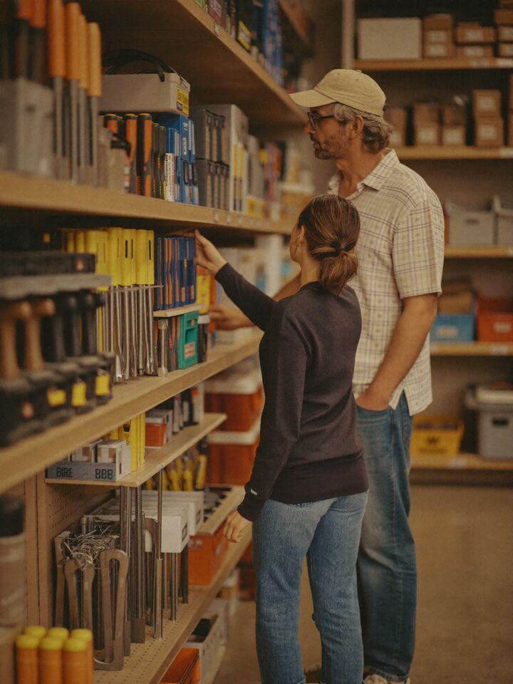 Hardware store owner helping a customer